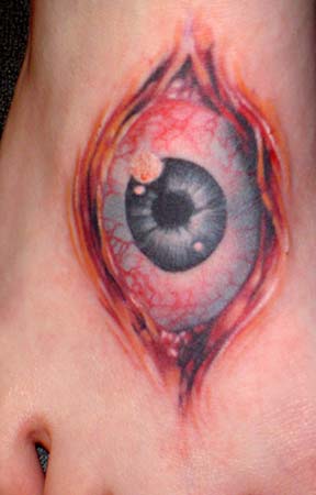 Looking for unique Tom Strom Tattoos?  foot eye tattoo