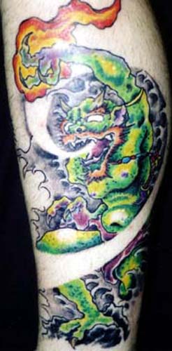 Tattoo Galleries: Green Demon Throwing Flame Tattoo Design