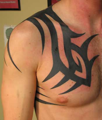 Looking for unique Tray Kamprath Tattoos tribal chest piece