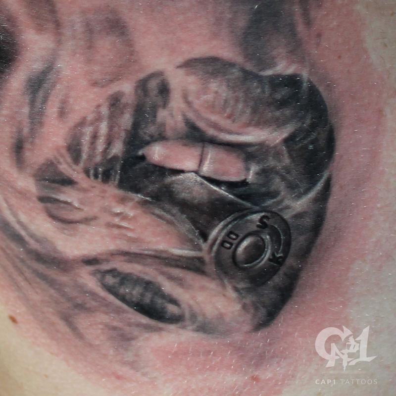 Cap1 Tattoos : Tattoos : Feminine : Bite the Bullet Smoking Rib Cage Tattoo  (Closeup)