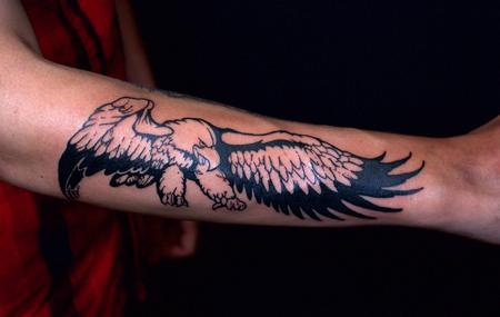 Music - Black Ernie Ball Eagle Tattoo on forearm