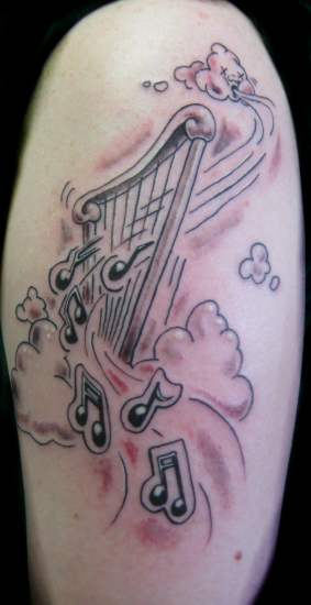 clouds tattoo. Harp in clouds tattoo