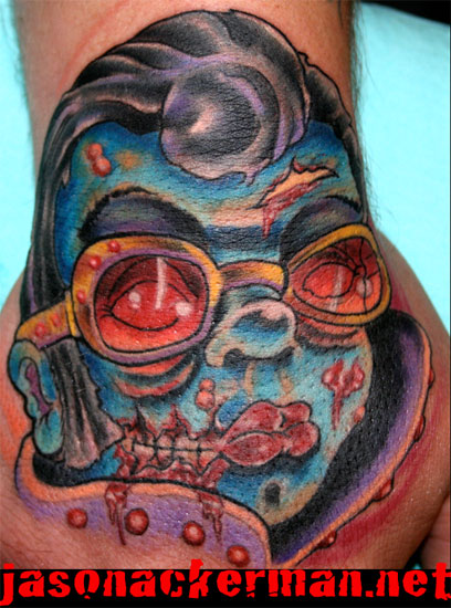 Jason Ackerman - zombie elvis hand tattoo