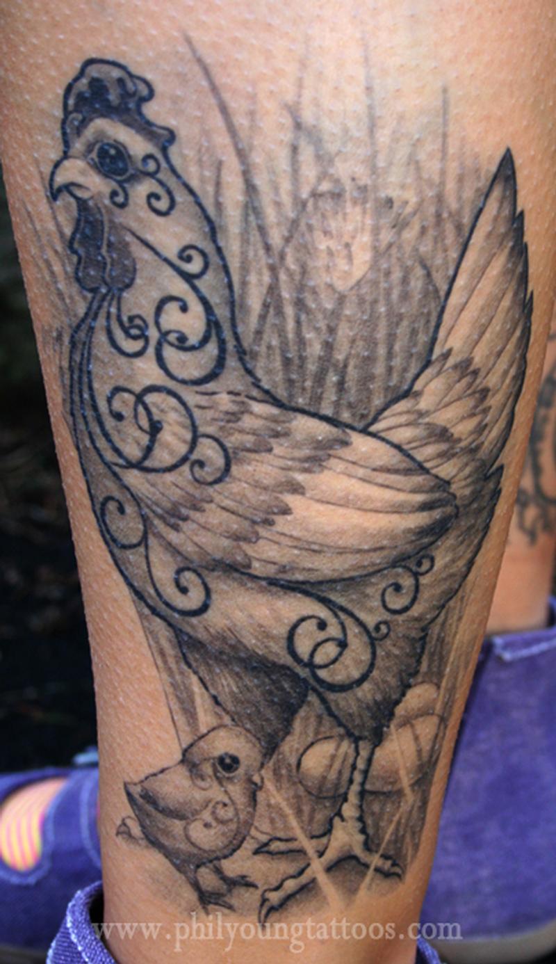 Healed chicken tattoo on a leg