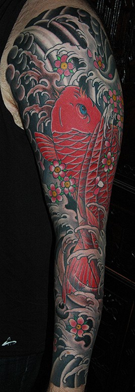 red koi with waves and cherry blossoms japanese sleeve tattoo