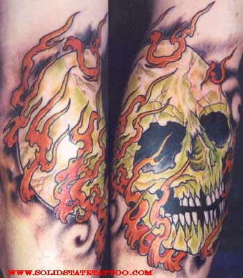 skull tattoos with flames. flaming skull