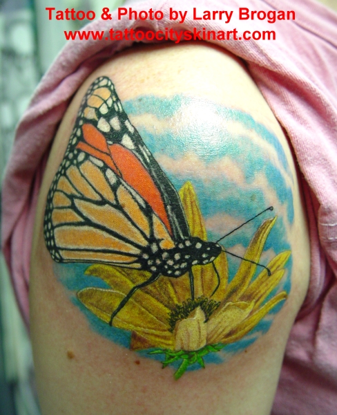 butterfly and flower tattoo. Butterfly on flower