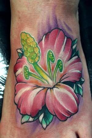 pink flower foot tattoo