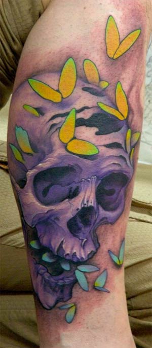 skull and moths tattoo