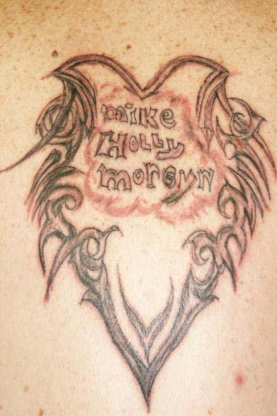 Tattoo_gone_bad_mike_holly_morgyn_horrible_tribal_cloud_L.jpg