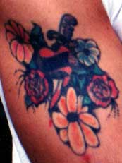 Really bad tattoo Tattoo Galleries: Dagger and flowers design